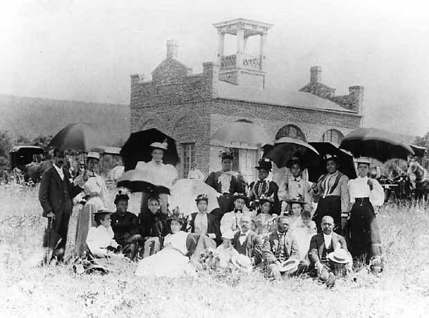 In this photograph taken on July 14, 1896, members of a pilgrim party from the National League of Colored Women pose in front of the fort. 