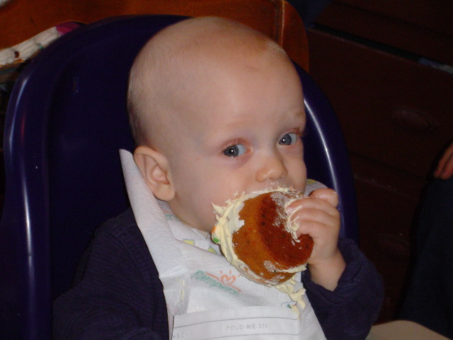 Harry eating his one-year-old birthday cake.