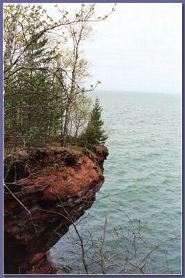 [red cliffs and a lake]