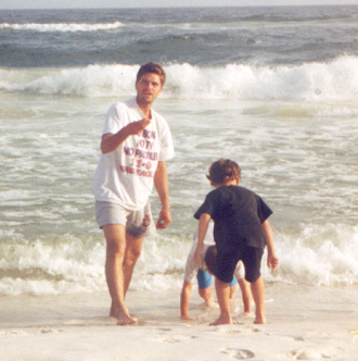 Jerry, James and Joshua playing in the sand and in the ocean on the beach