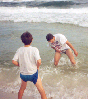 jerry and james in the ocean trying hard not to get their clothes wet