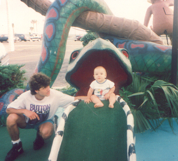 Joshua sitting in the snakes mouth as Jerry stays close by to keep him from falling