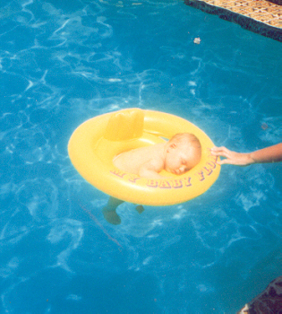 Joshua sleeping in the hotel swimming pool