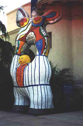 I think thats a really fat man on the bottom with a very odd woman up top, I am not sure to be offended, sick, entrigued or all of the above... I still have no idea what it is though!