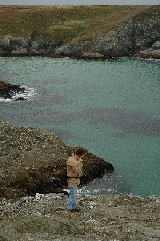 Chris on the phone on the cliffs