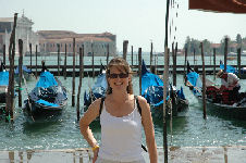 Cyndi in front of lagoon and gondolas