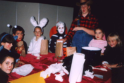 Farmer Kelly and a cheerful group of trick-or-treaters