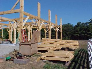 Knee braces and floor joists stacked ready for assembly