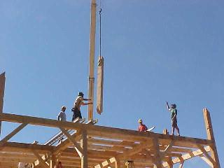 Queen post being lowered into position