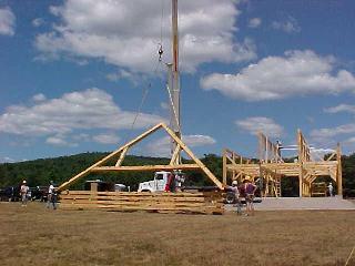 First rafter truss being lifted off the stack