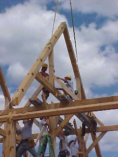 Twenty joints come together as the rafter truss is lowered into place