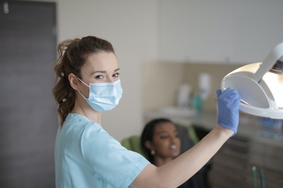 Dental assisstant in chair