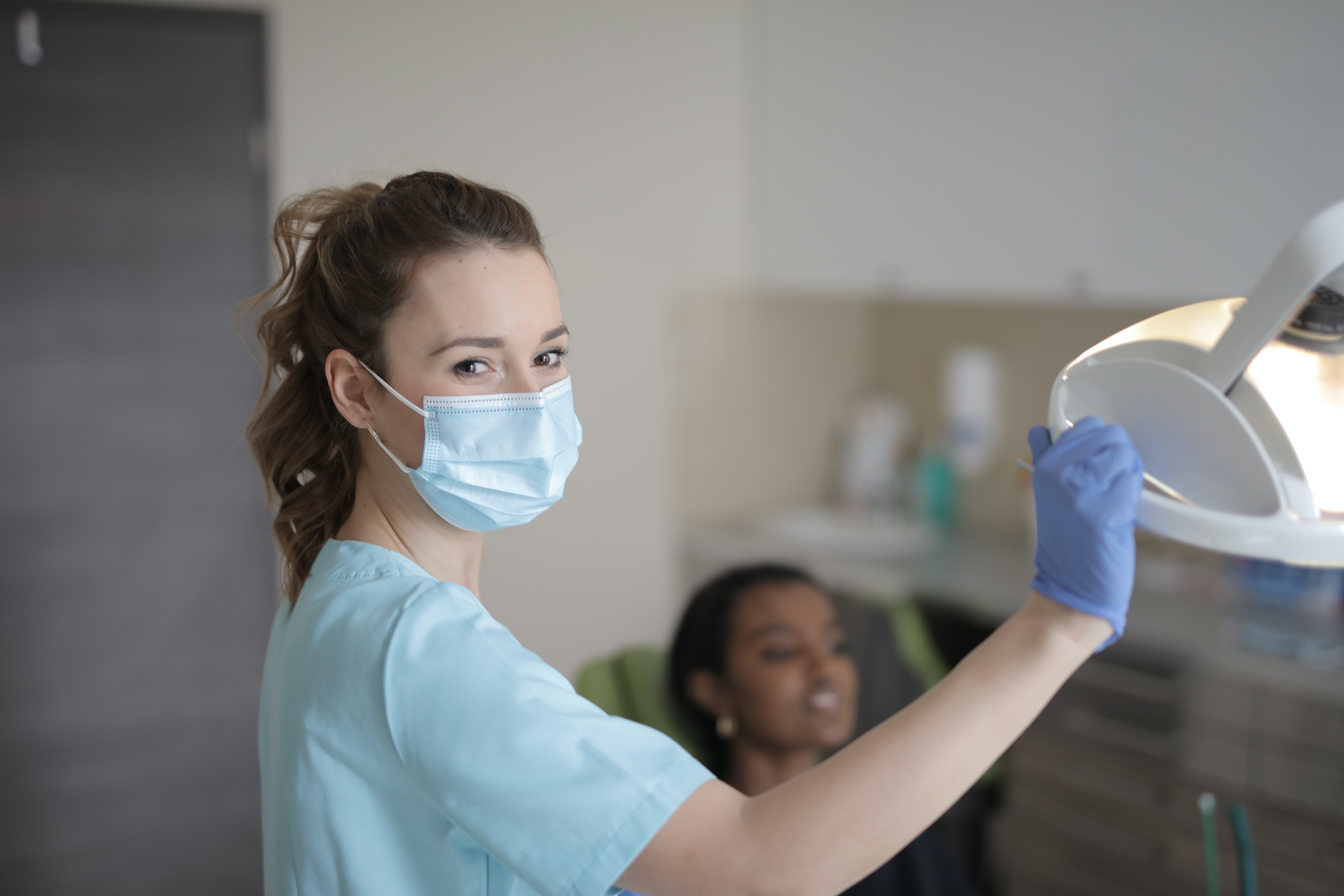 Dental assisstant in chair