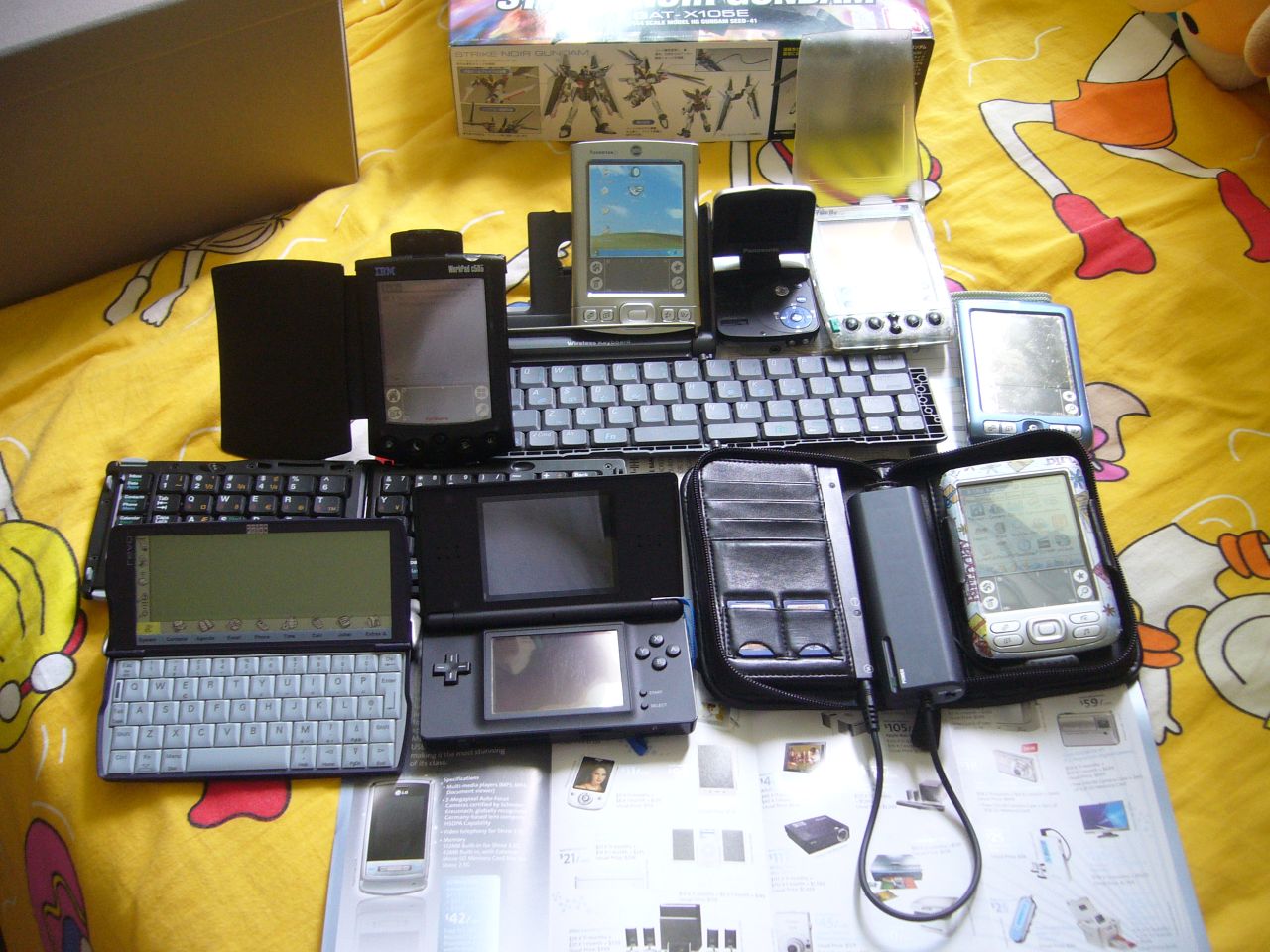 my latest PDA collection - IIIe, c505(on Prolink wireless keyboard), Zire71, Zire72(with Enfora Wireless Portfolio), Tungsten E(on Palm wireless keyboard), Revo