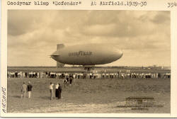 Goodyear Blimp "Defender" with Crowd at Airfield 1930