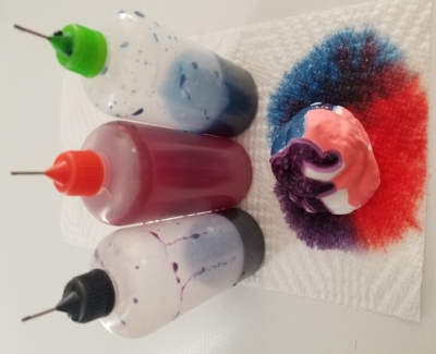 shaving cream with dripped liquid dye