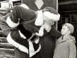Santa speaking with young boy