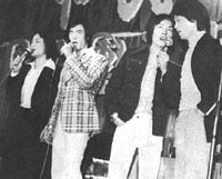 Lu Feng, Sun Chien, Chiang Sheng and Philip Kwok singing a song
