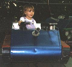 Emily riding a tank