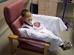 Alex holding Tyler - The day Tyler was born