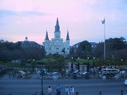 Jackson Square with carriages in front & St Louis Cathedral beyond.