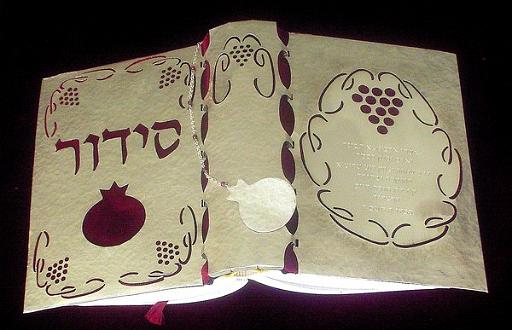 sidur1.jpg - silver and garnet on velvet