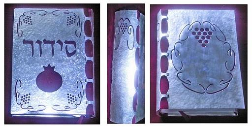 sidur2.jpg - silver and garnet on velvet