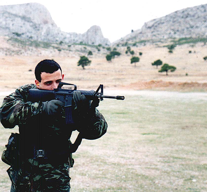 A Hellenic Infantry man adorns an M-16 automatic rifle