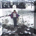 alexinfrontofsnowman.jpg (29445 bytes)