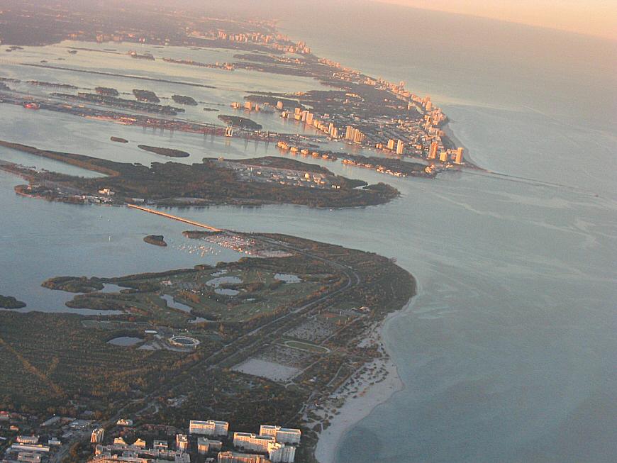 You approach Miami from the Everglades, then swing out over the Atlantic Ocean and bank back in towards the city.  Pretty sure the center off this shot is Miami Beach with Biscayne Bay behind, to the left.