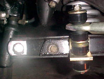View of bracket test fitted in A arm next to the triangular reinforcement plate.