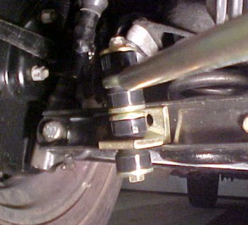 Aadco bracket fitted in slot on A arm, bracket hole used to mark for drilling 3/8" hole.