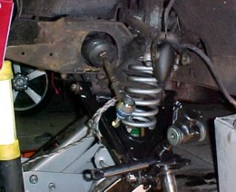 Spring and rebound rubber in place, Swivel arm ready to lift into damper arm..