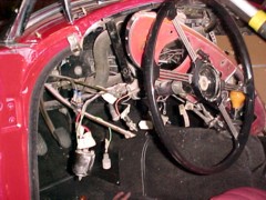 The steering wheel clamp was loosened so it could drop down and give a few more inches for working.