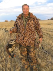 We left our decoys to hide behind haybales as waves of geese passed over us for a pea field beyond our set-up.