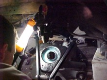 Left hand spring pan with lower king pin in place, grease in spring pan spring retainer.