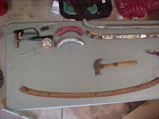 Wooden and aluminum rails, old red cover for template.