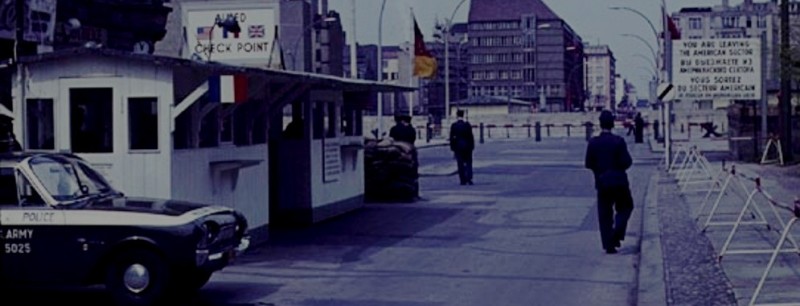[Checkpoint Charlie, view from the American-British-French sector facing east. Note the Berlin Wall beyond.]