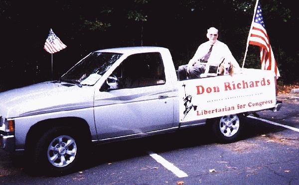 [Don Richards and friend Swee'Pea
 aboard float following the July Fourth parade in The Woodlands, in parking
 lot at parade start/end, 1030, July 4 1998]
