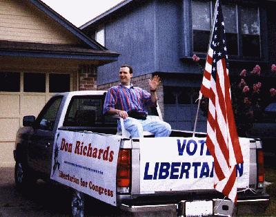 [Scott Gordon (left) and Gil Guillory (right)
aboard float in Gil's driveway 0730 July 4 1998]