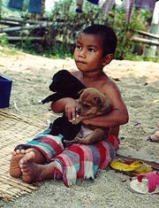 Hilltribe Kid & Puppies