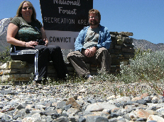 Candace & I sitting at the sign on the way up to Convict Lake Nat'l Forest.