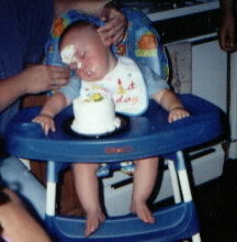 cake all over his face
