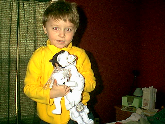 Cam at my house, holding my wedding beanies, Decembero 2005