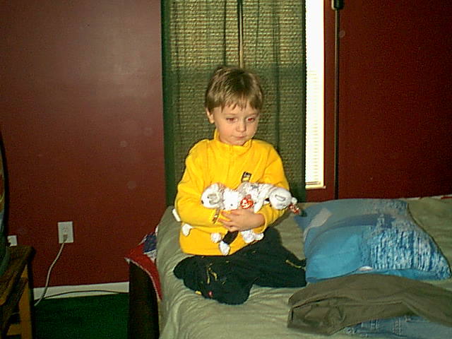 Cam at my house, holding my wedding beanies, Decembero 2005