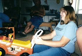 Noelle playing with cameron's truck