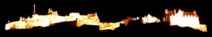 Edinburgh Castle lit up at night.