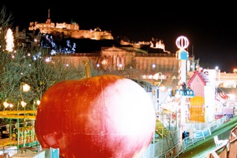 Rides and amusements under the Castle at night.
