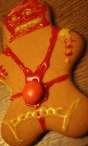 My gimp-style gingerbread man, complete with zipper-mask and an orange Smartie chastity belt.