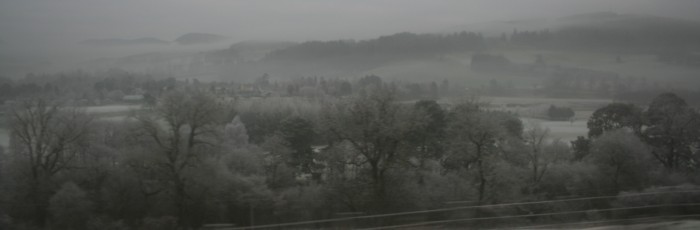 Snow covering the farmland and hills of the Cairngorms, seen through the bus window on my southbound journey back to Edinburgh.